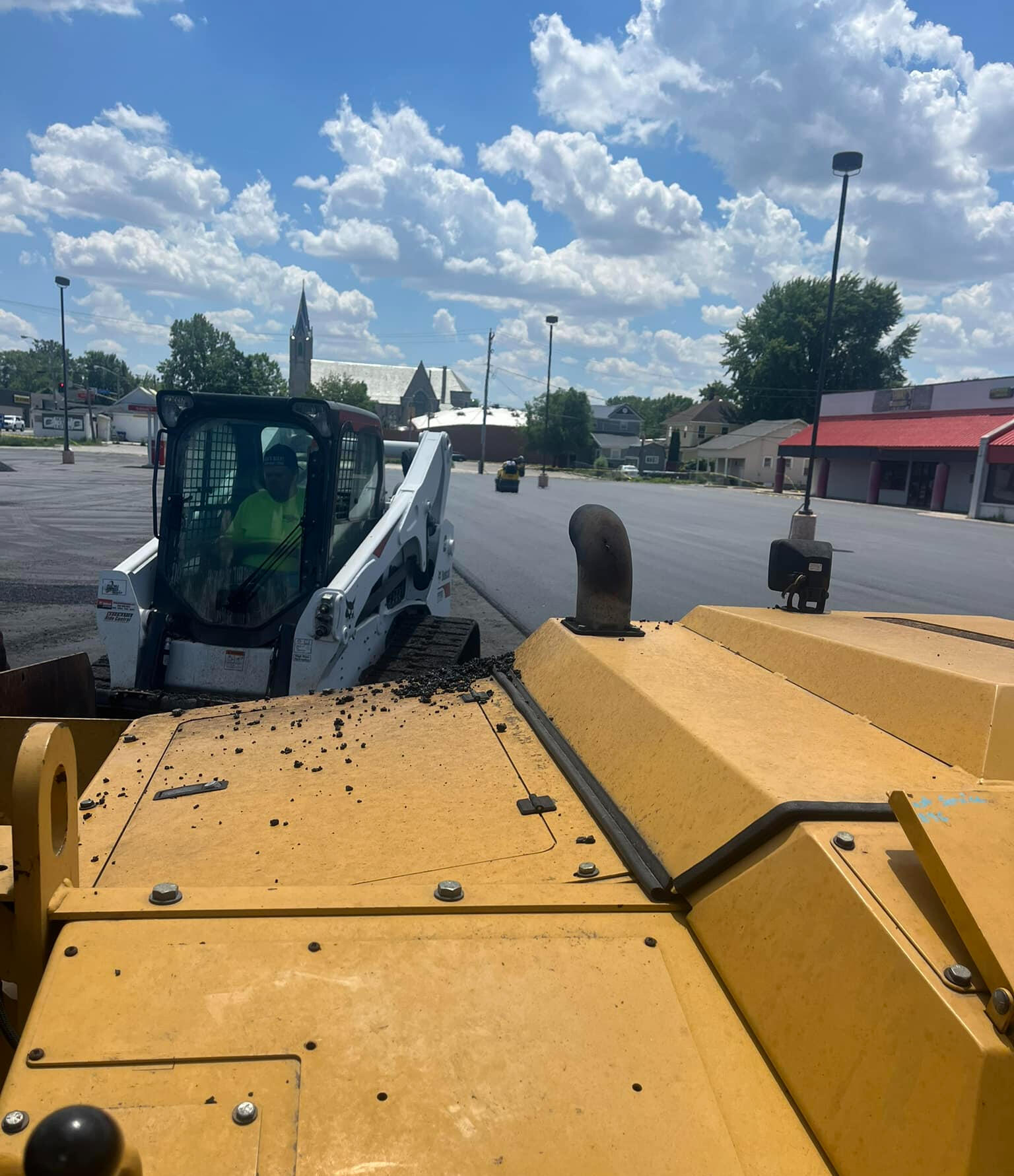 Commercial paving equipment preparing a work area