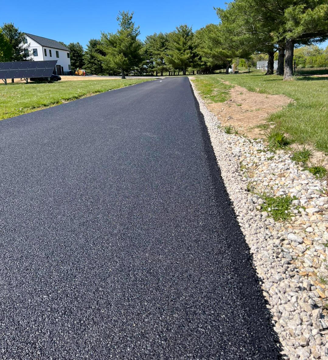 Smooth black asphalt driveway with a clean finished edge